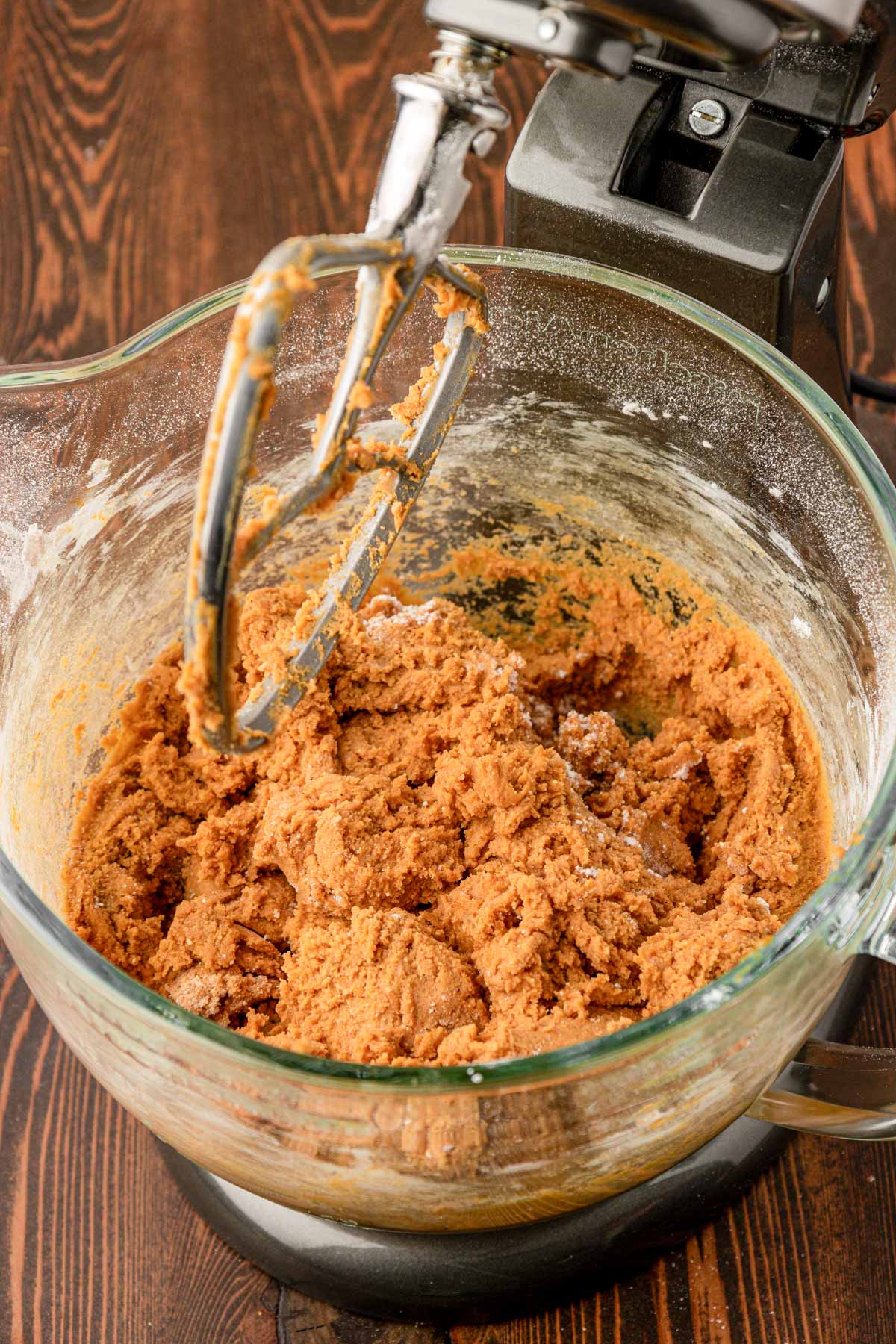 Pumpkin cookie dough in a stand mixer.