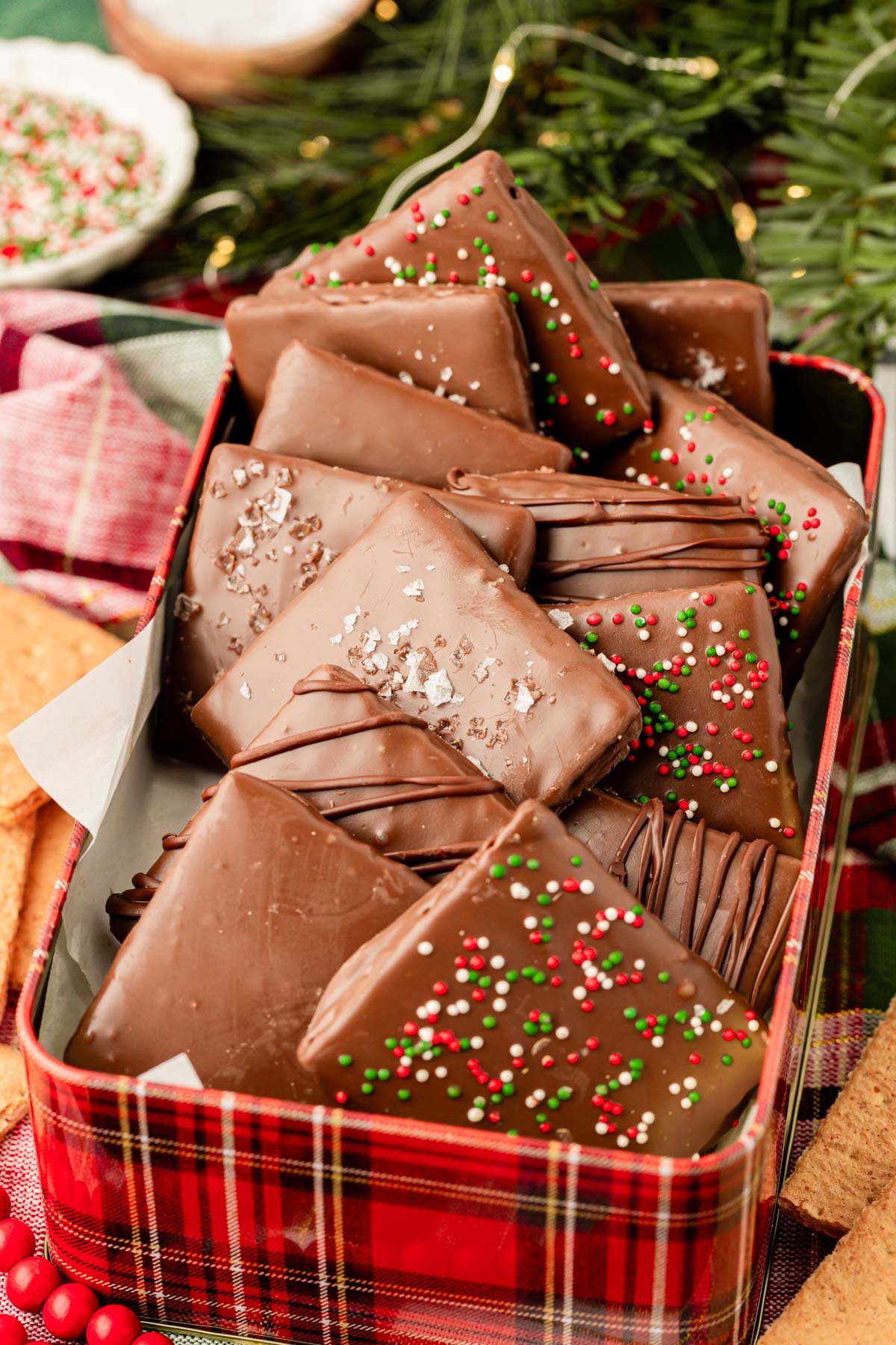 Chocolate covered graham crackers in a cookie tin.