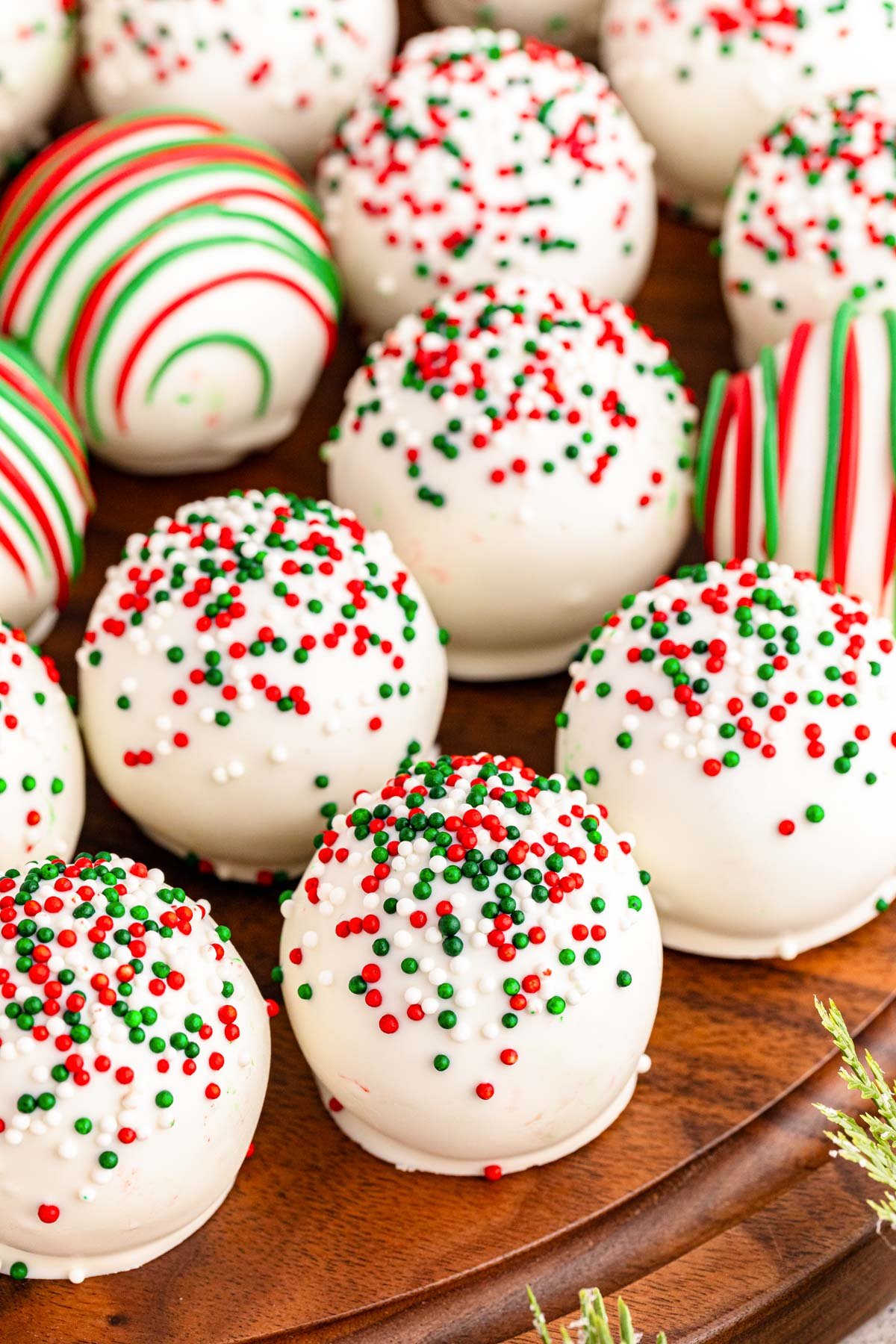 Christmas Cookie Truffles on a wooden platter.