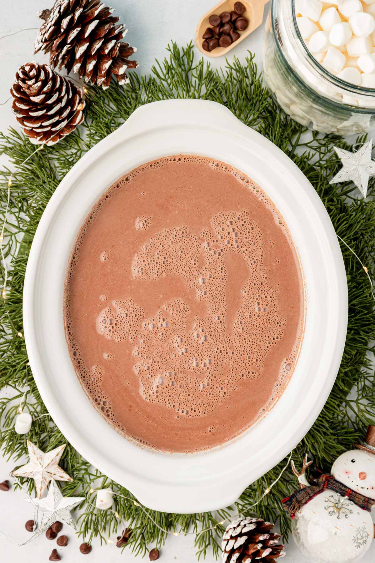 Hot chocolate in a white crock pot.