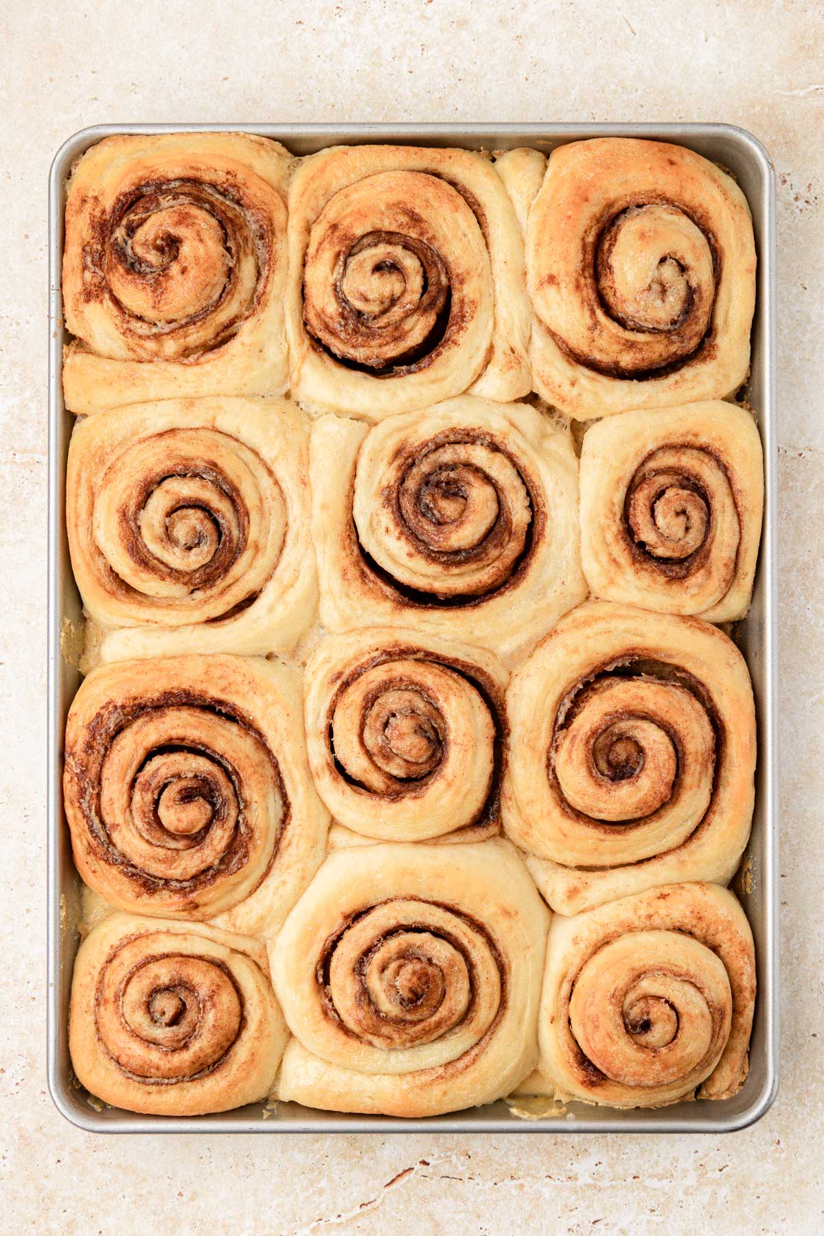 Cinnamon rolls baked up in a pan.