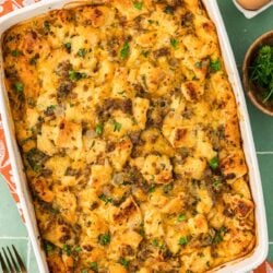 Overhead photo of Sausage Breakfast Strata on a green surface.