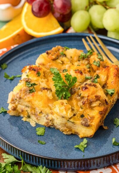 A slice of sausage strata on a blue plate.