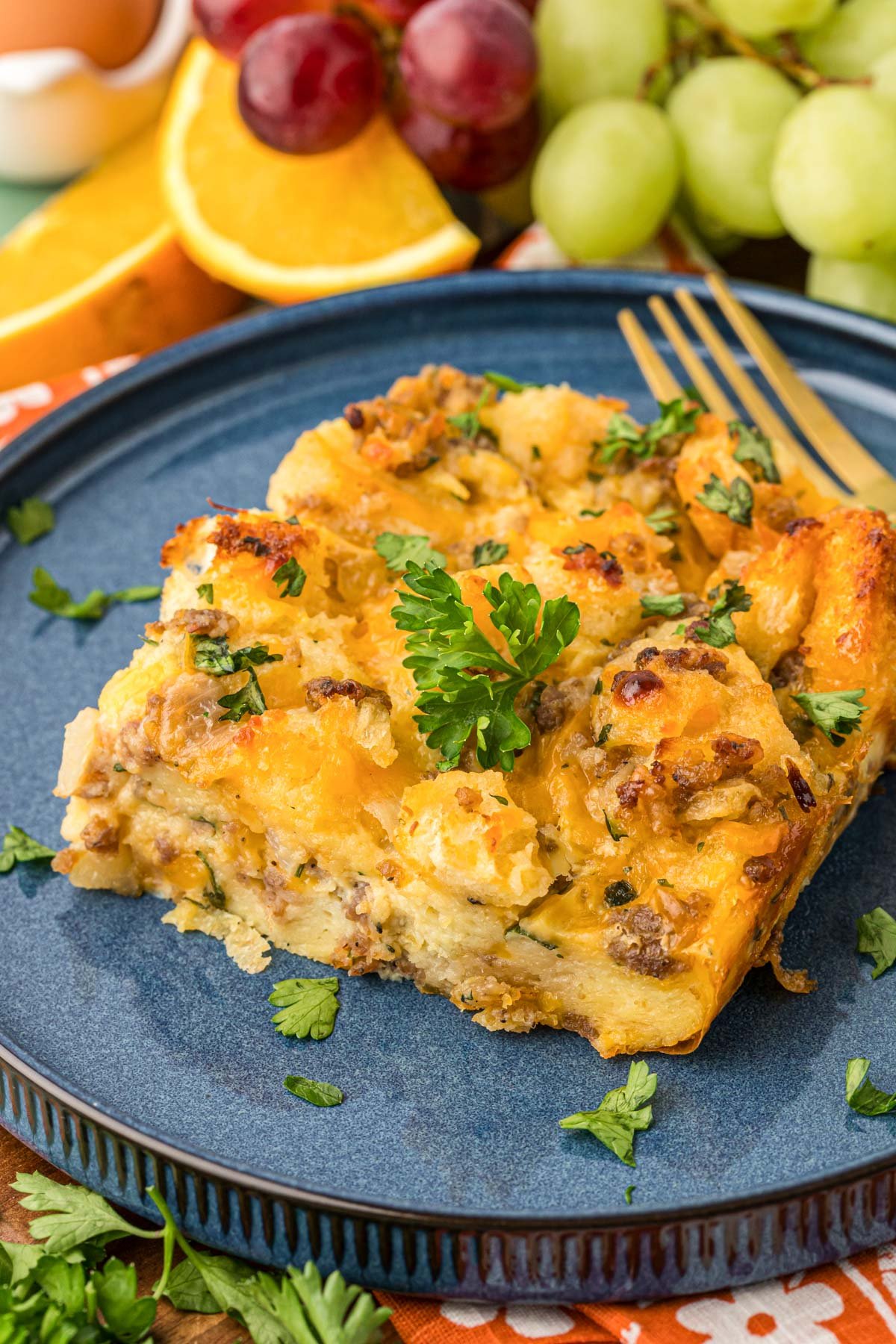 A slice of sausage strata on a blue plate.