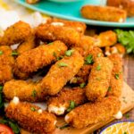 Mozzarella Sticks on a wooden board.