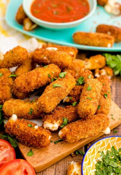 Mozzarella Sticks on a wooden board.