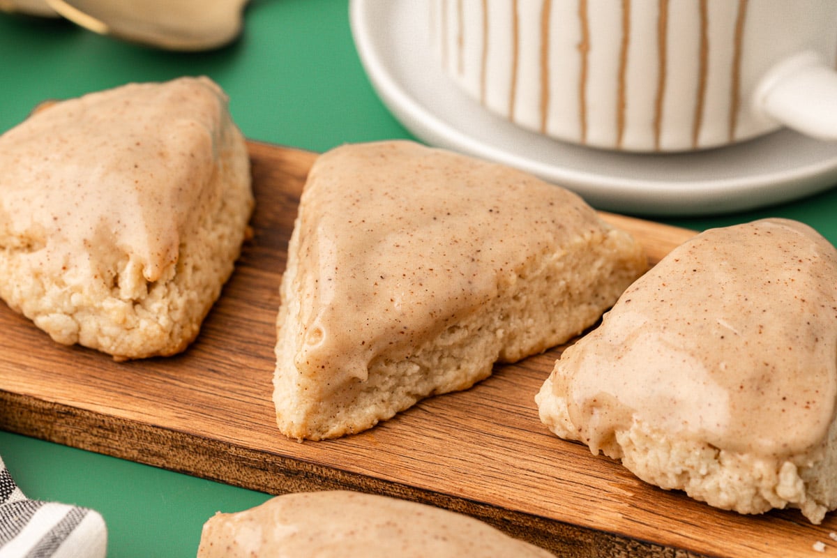 Vanilla bean scones on a wooden board.