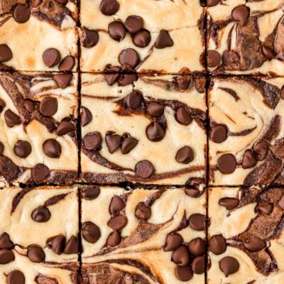 Overhead photo of cream cheese brownies that have just been sliced.