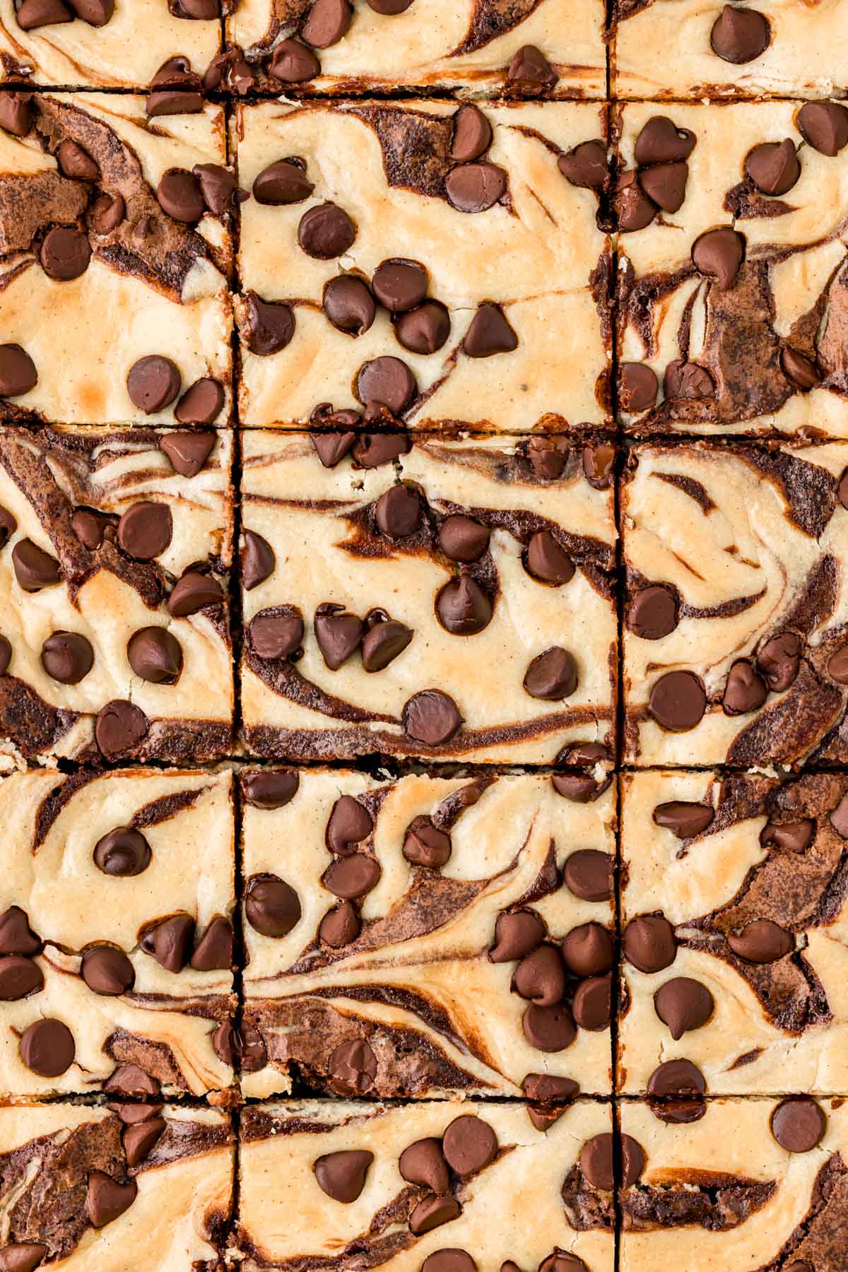 Overhead photo of cream cheese brownies that have just been sliced.