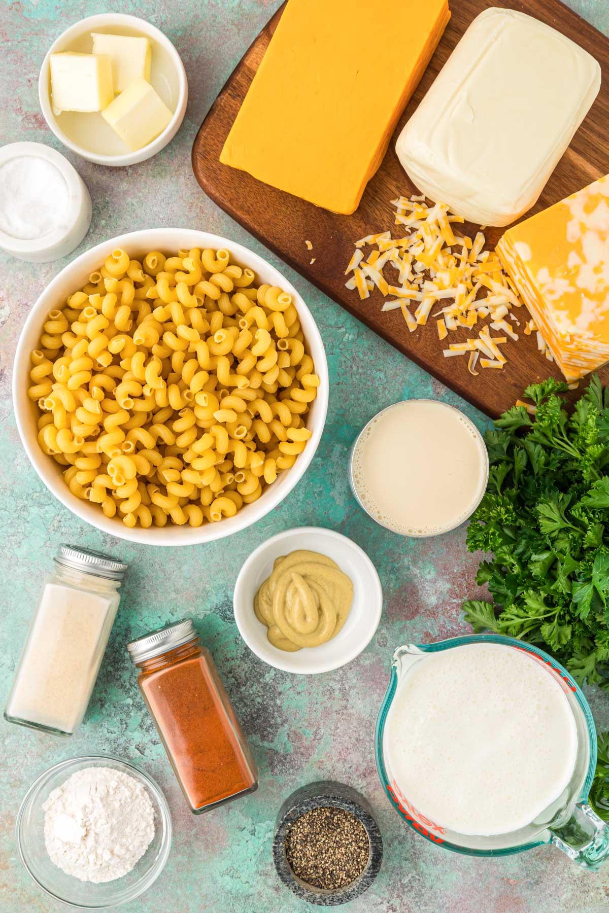 Overhead photo of ingredients to make mac and cheese on a table.