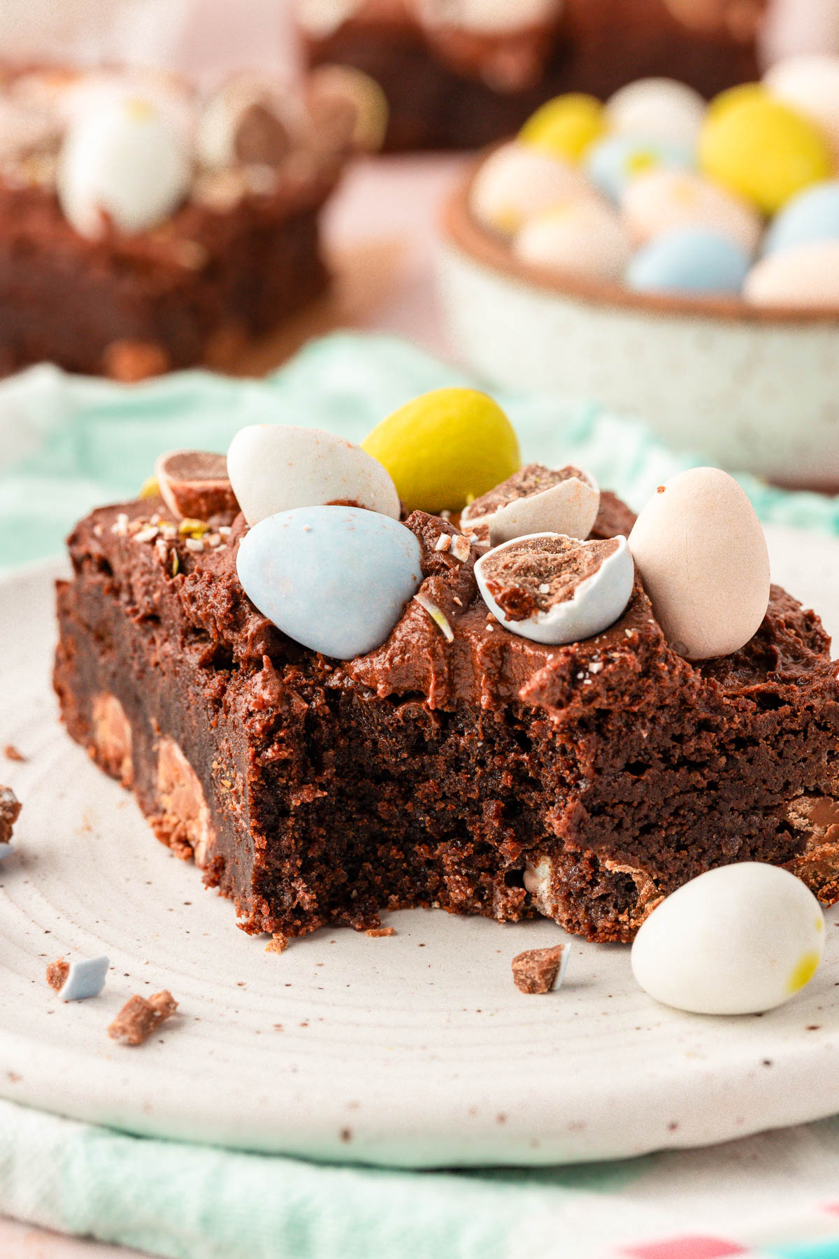 Cadbury Brownie on a plate with a bite missing.