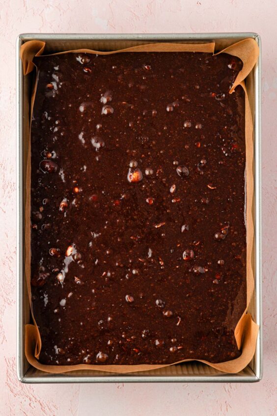Brownie batter in a 9x13-inch baking pan.