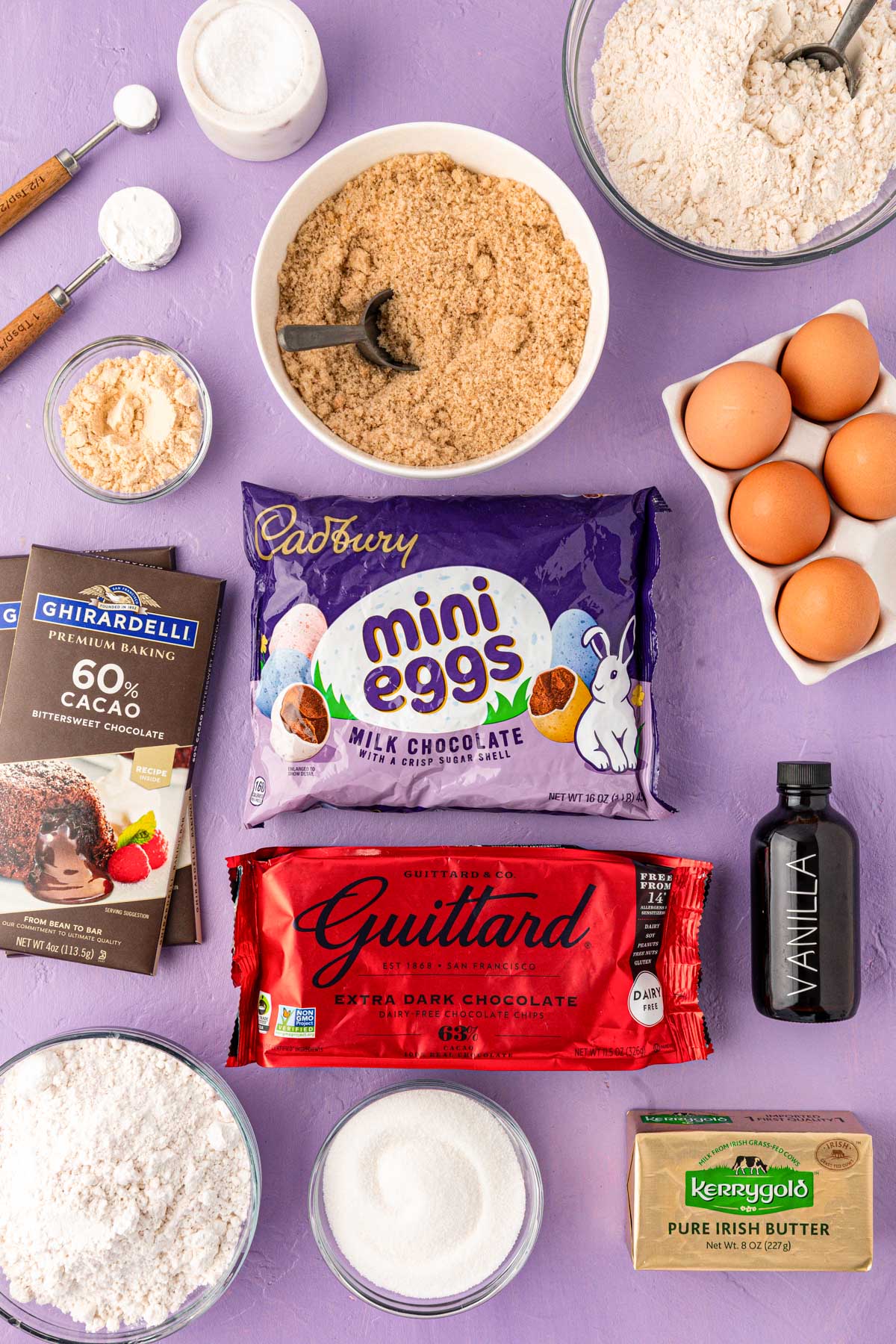 Overhead photo of ingredients to make Cadbury Mini Eggs on a purple surface.