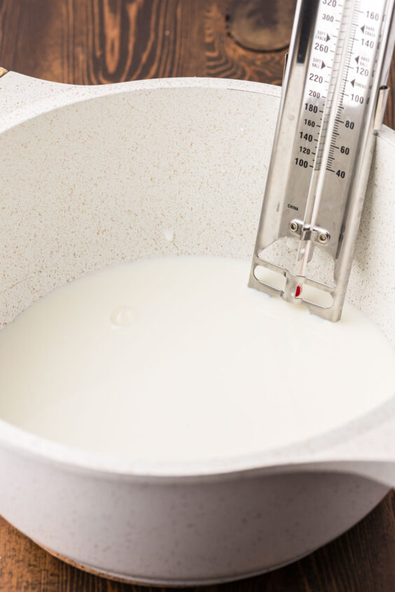 Milk being heated in a saucepan.