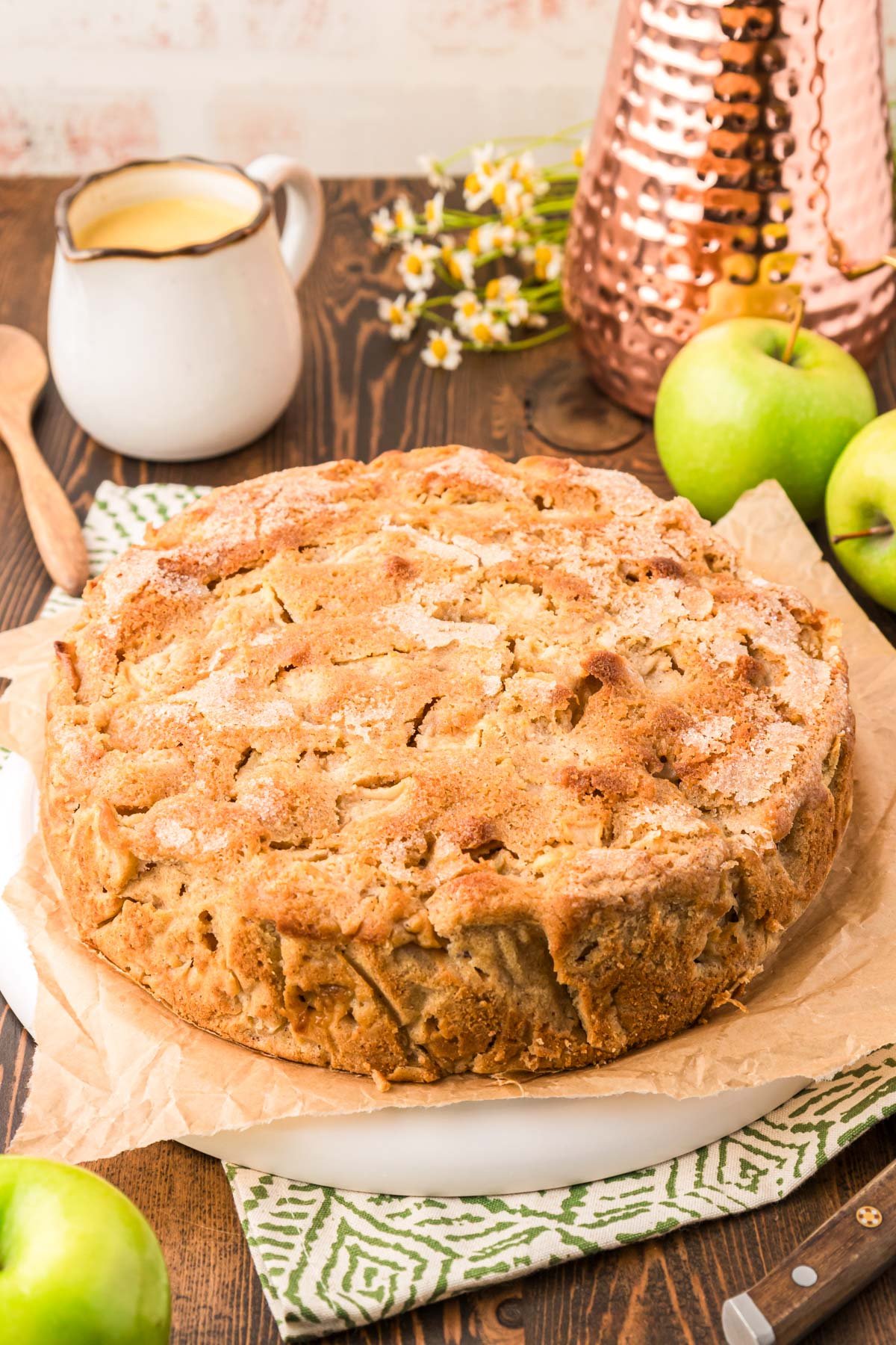 A whole round Irish Apple Cake on a plate.