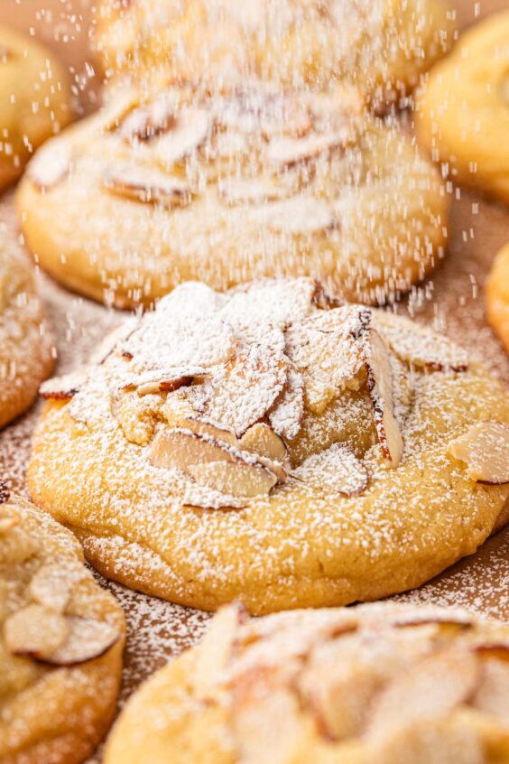 Close up of almond croissant cookies on a tray.