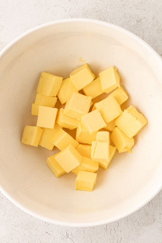 Butter cubed up in a bowl.