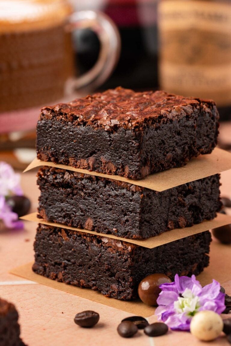 Close up of a stack of three coffee brownies.