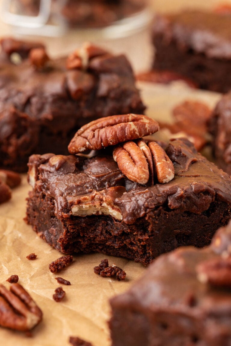 Close up of Texas Sheet Cake Brownies on a piece of parchment paper.