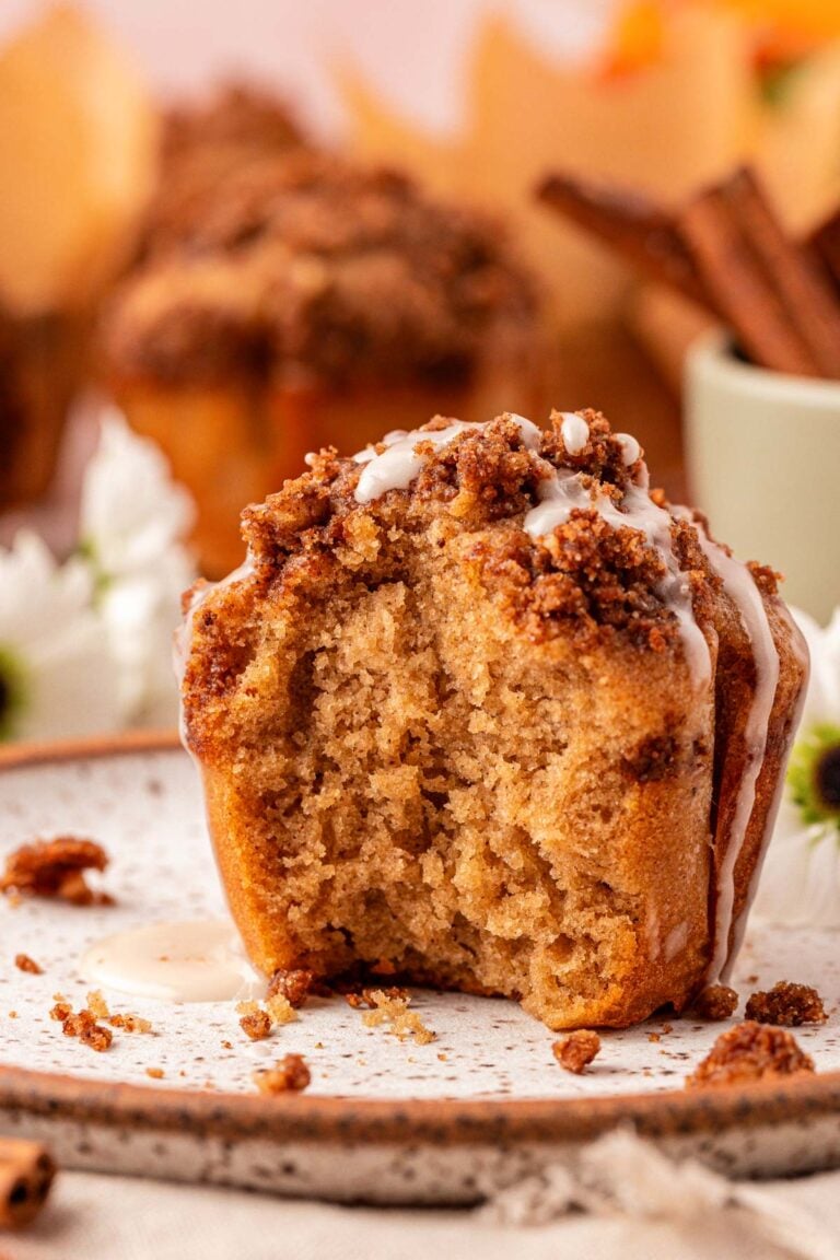 Close up of a cinnamon muffin with a bite missing.