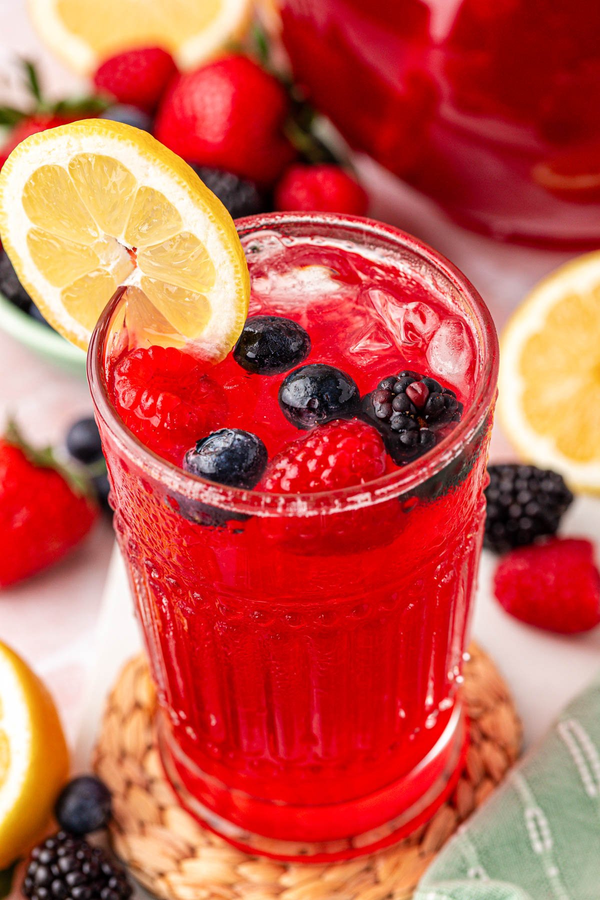 Close up photo of a glass of berry lemonade.