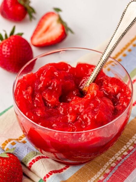 Close up of a bowl of strawberry cake filling.