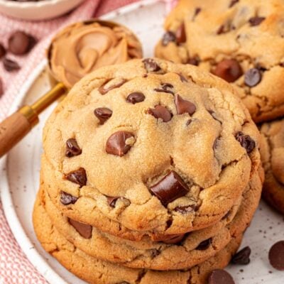 Close up of a stack of peanut butter chocolate chip cookies.