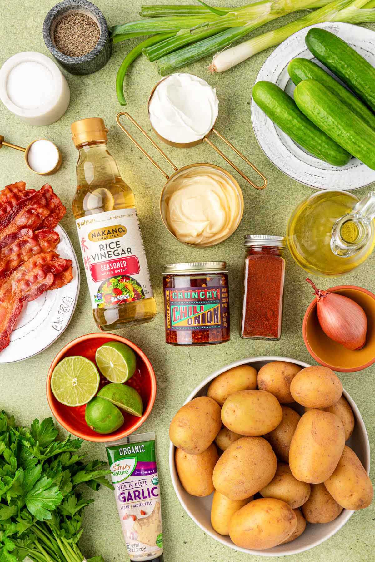 Ingredients to make Chili Crisp Potato Salad on a counter.