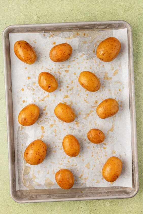 Baby yukon potatoes on a baking pan.