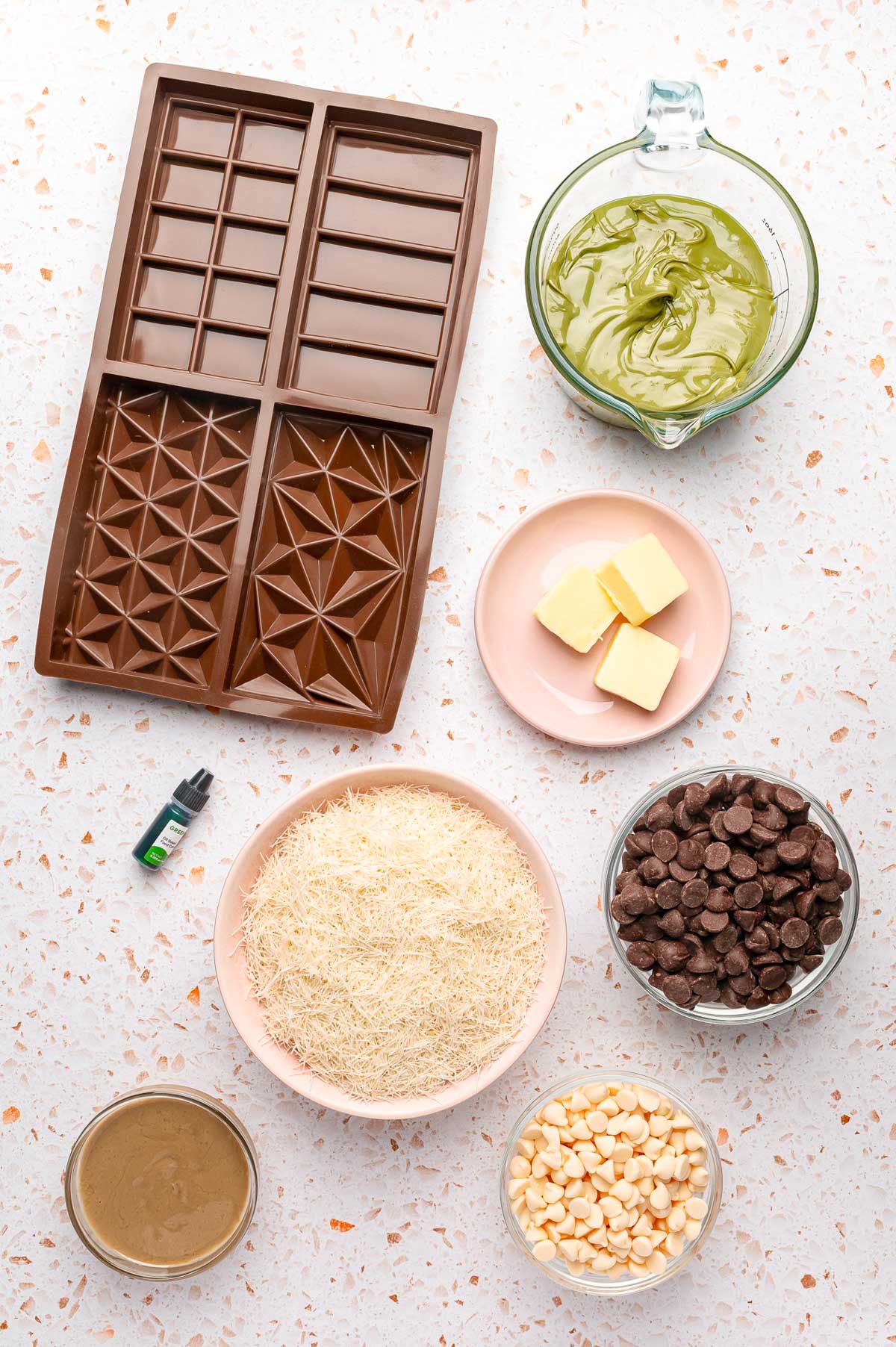 Overhead photo of ingredients to make Dubai chocolate bars on a table.