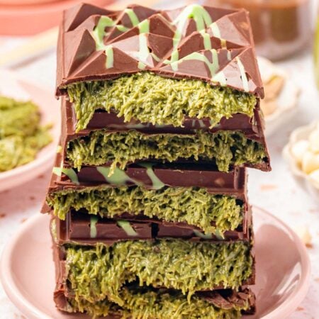 Close up of a stack of Dubai Chocolate Bars that have been broken in half to reveal the filling in the center.