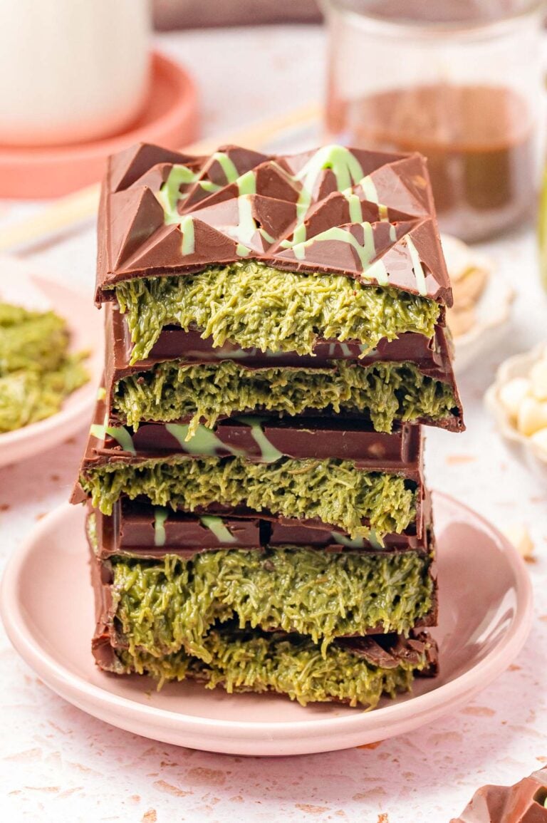 Close up of a stack of Dubai Chocolate Bars that have been broken in half to reveal the filling in the center.