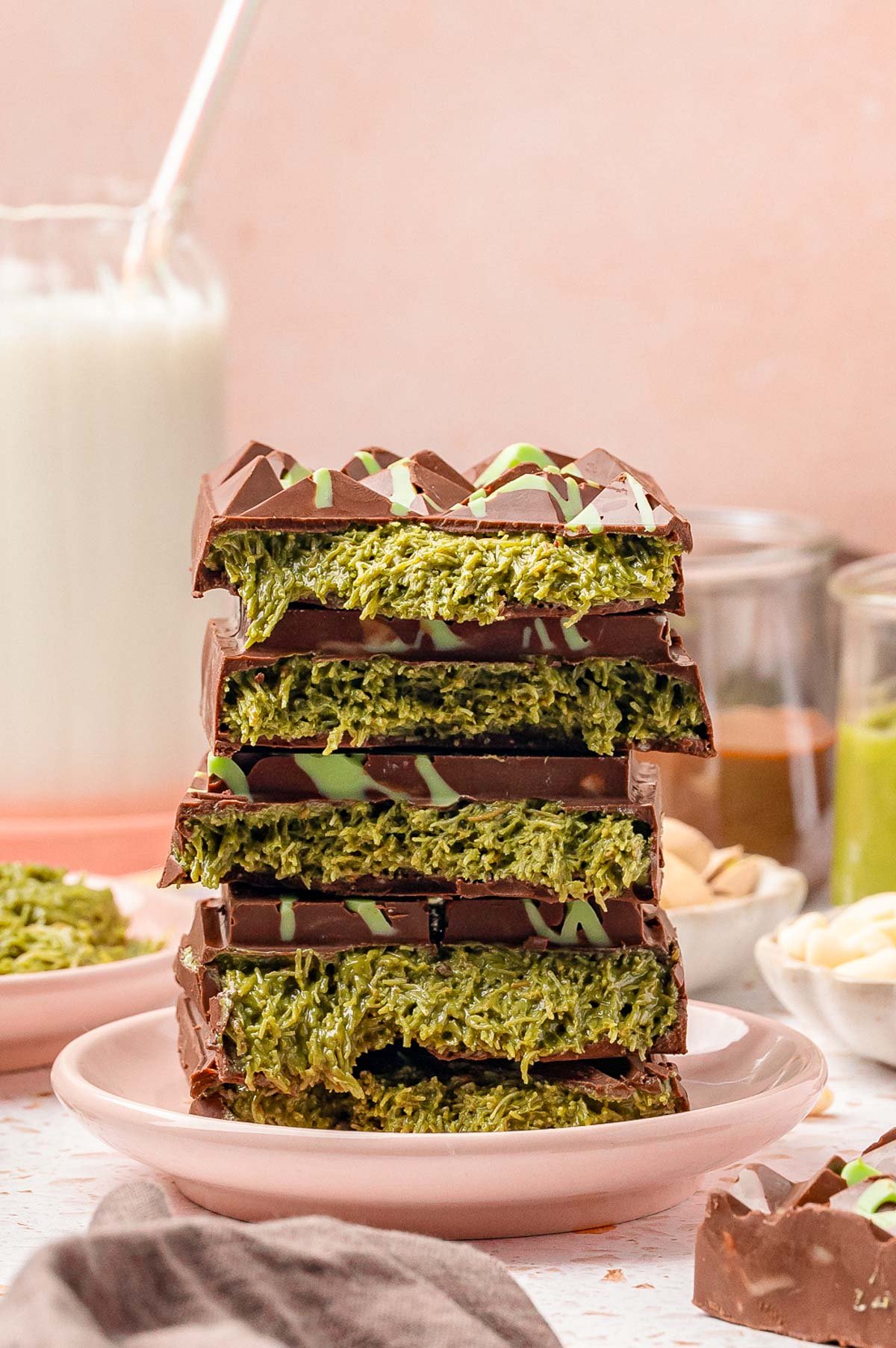 A stack of viral Dubai chocolate bars stacked on a small pink plate.