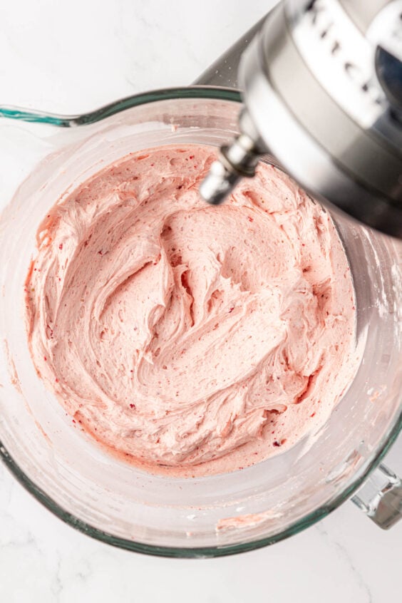 Strawberry frosting in a mixing bowl.