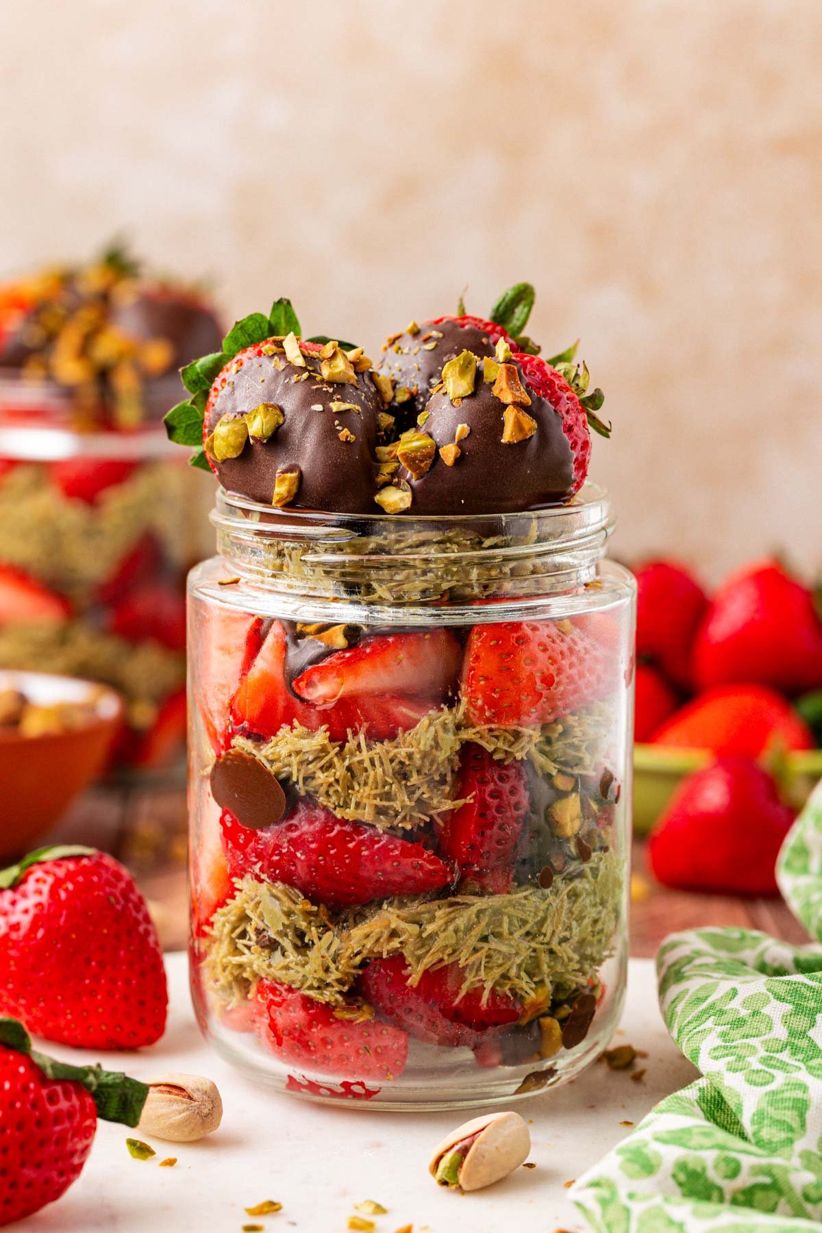 Strawberry Pistachio Dubai Cup on a white table.