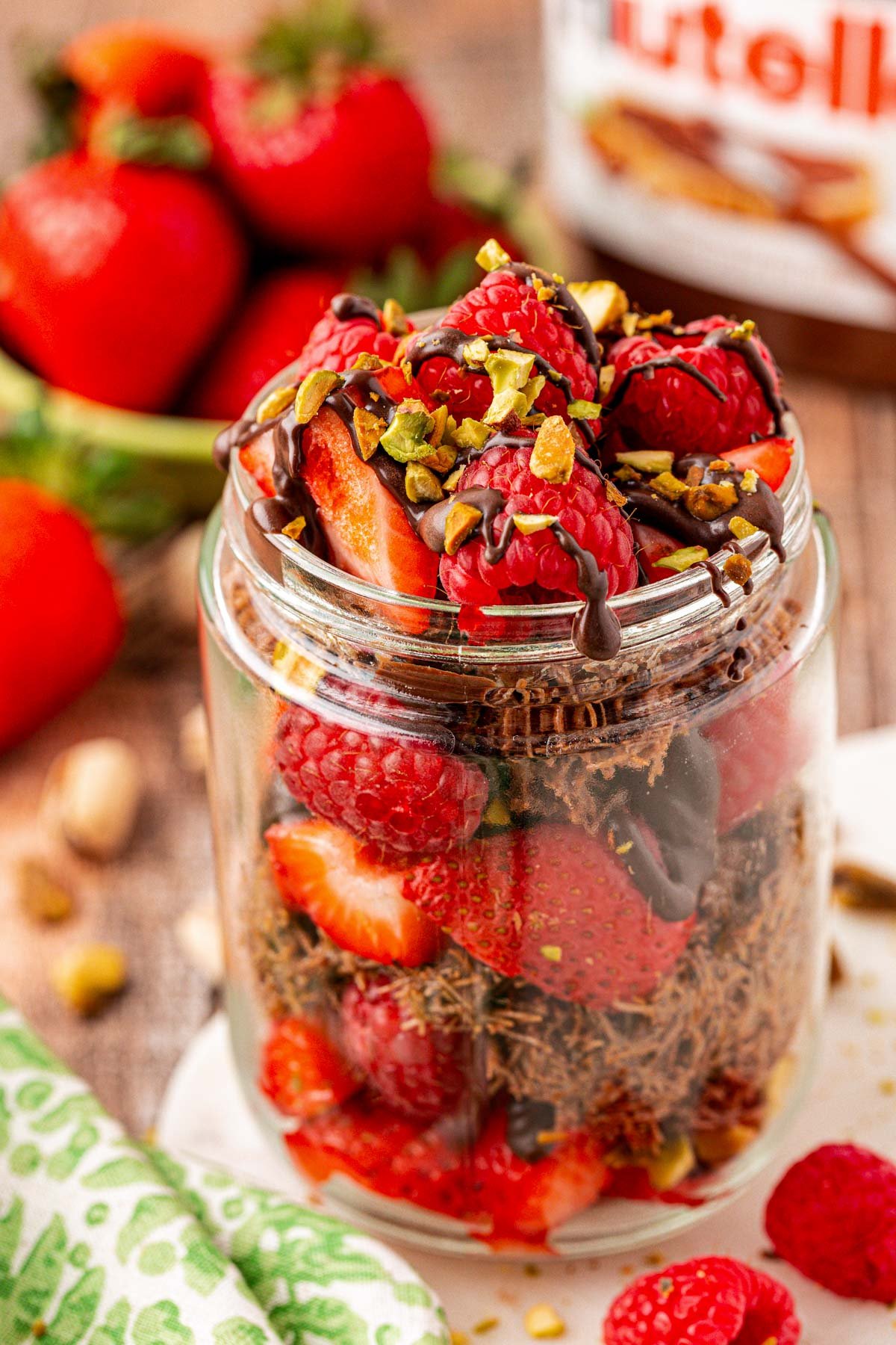 A jar of Nutella Dubai Strawberry Cups on a table.