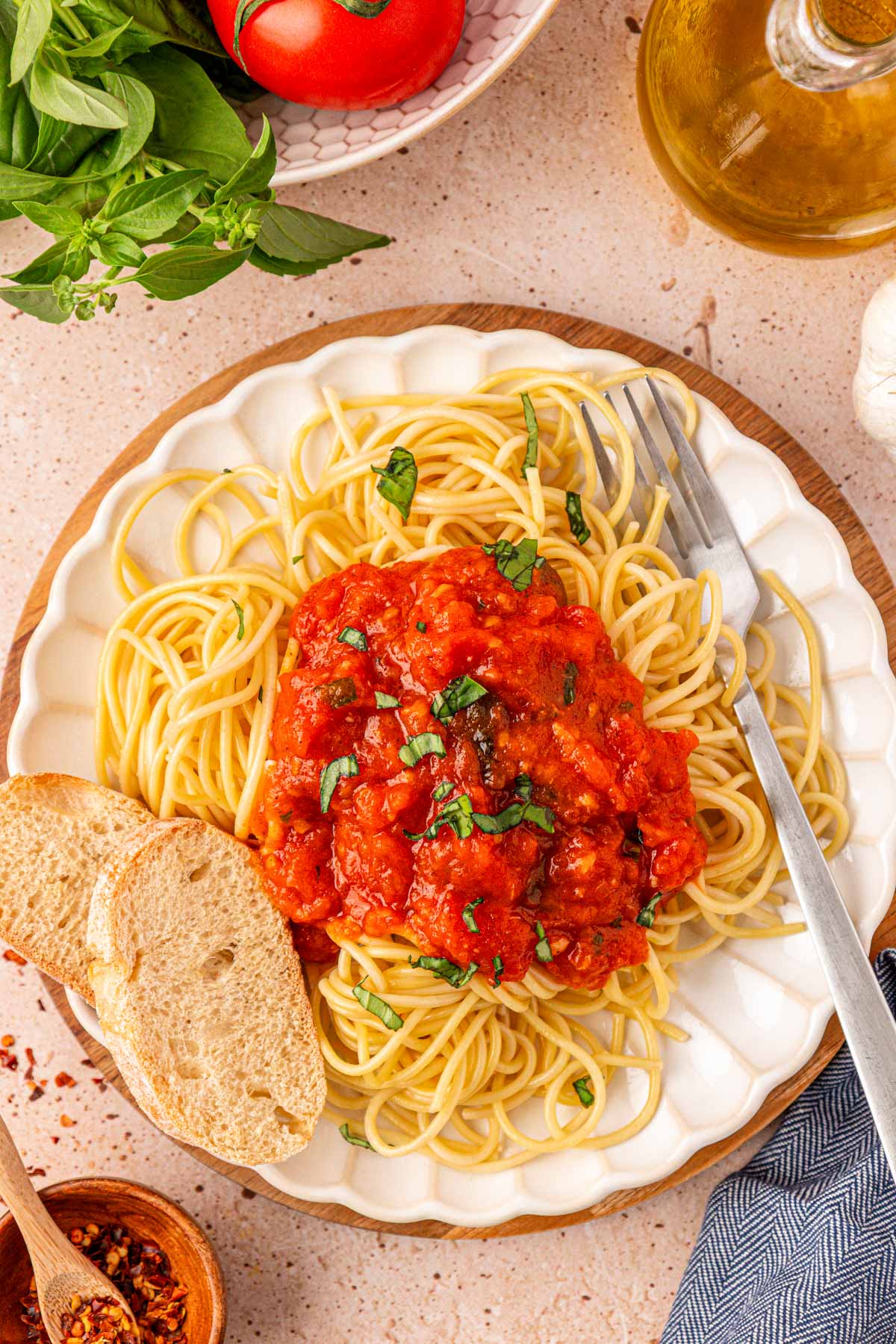 Overhead photo of a plate with spaghetti and marinara sauce.