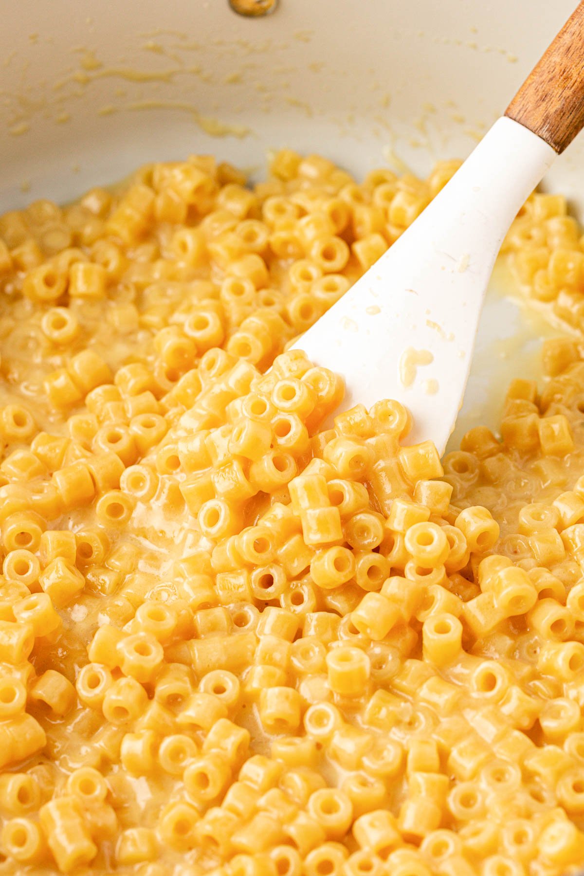 Creamy Garlic Ditalini Pasta recipe in a pan with a white rubber spatula.