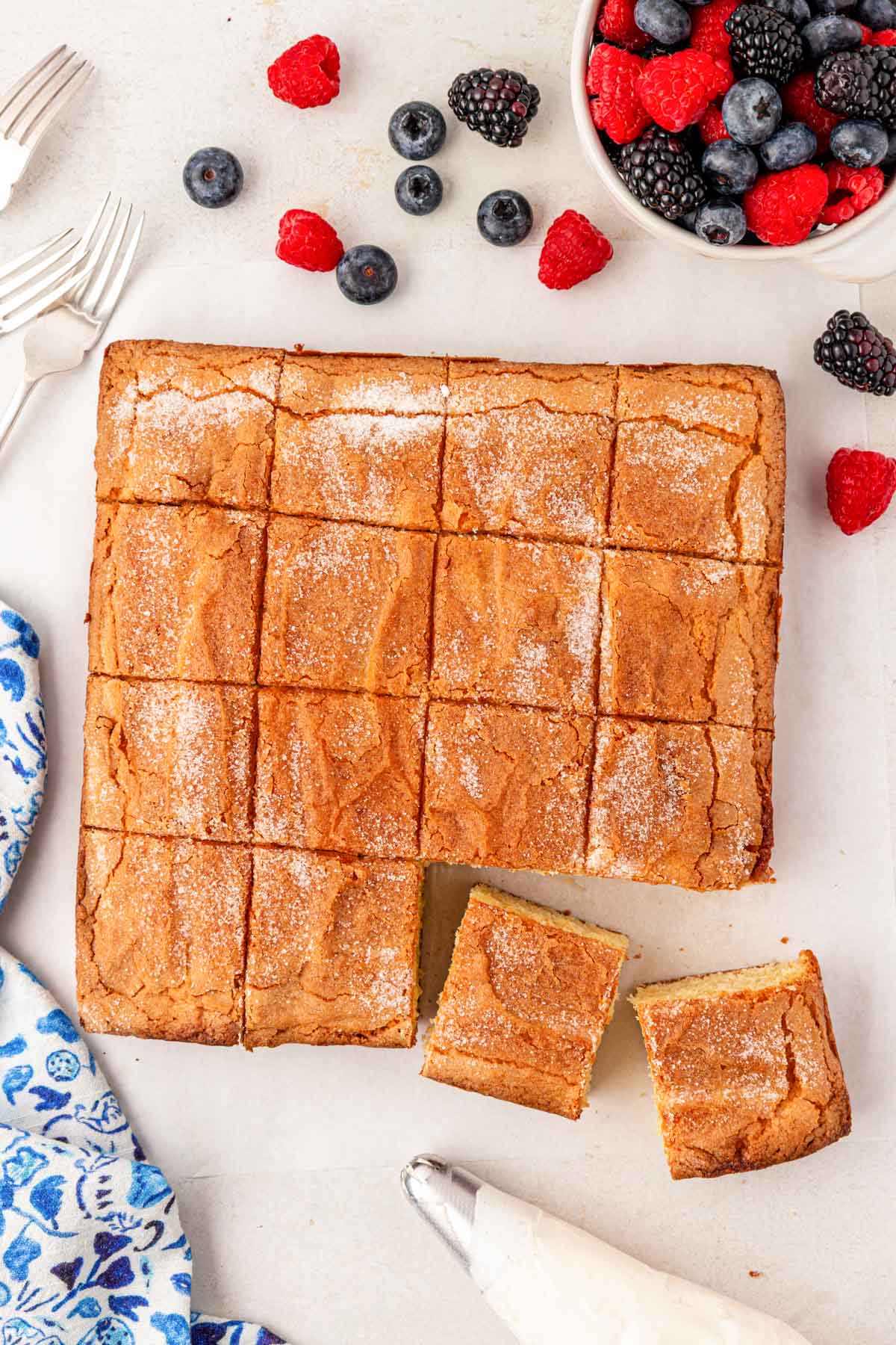 Overhead photo of sliced butter cake on a table.