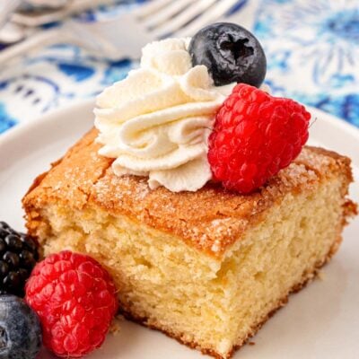 Close up of a square slice of fluffy butter cake.