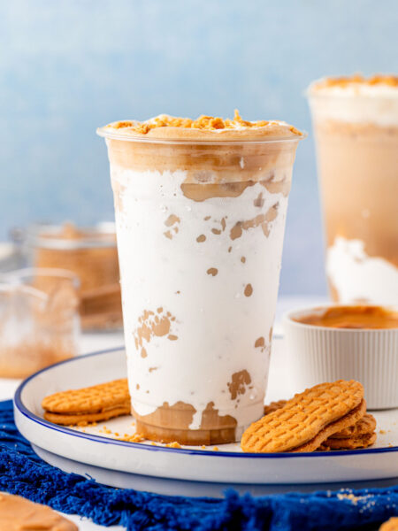 Close up of a cup filled with a fluffy seagull latte.