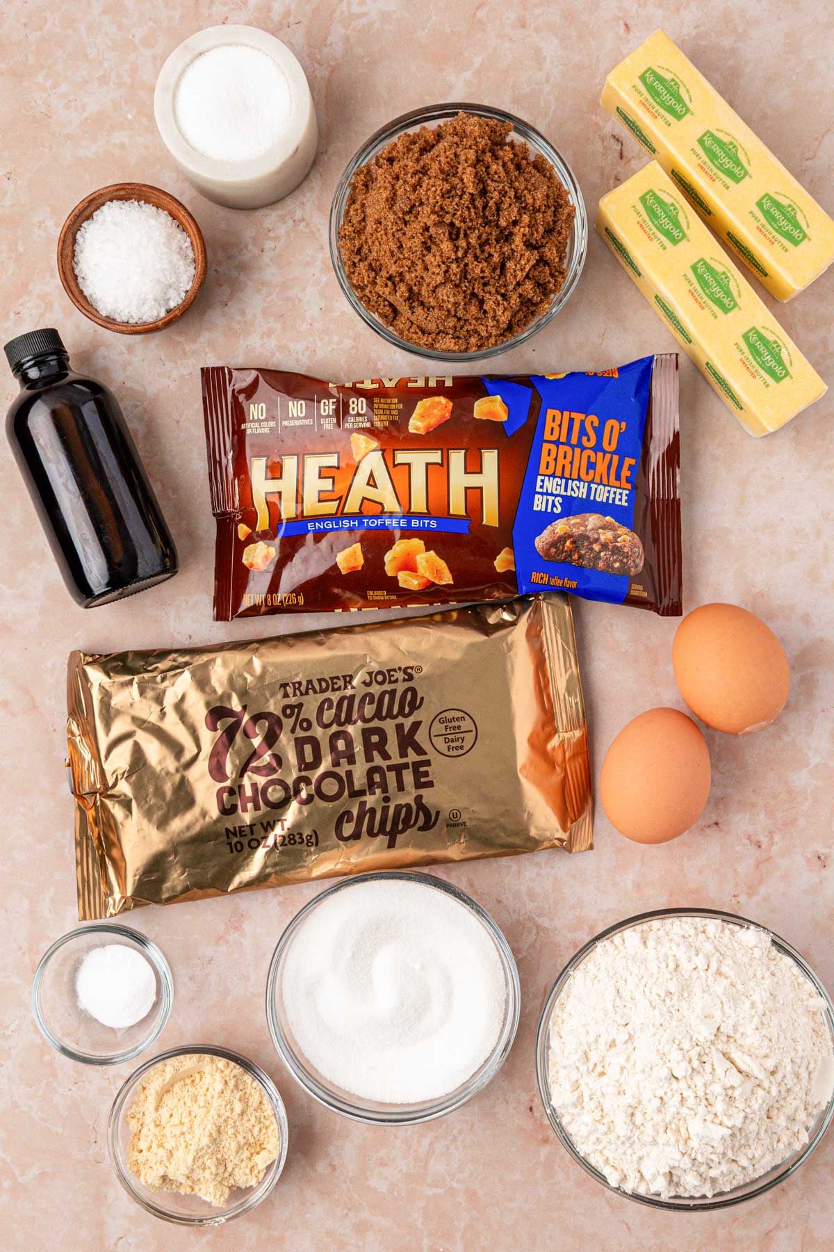 Ingredients to make brown butter chocolate chip cookies with toffee on a table.