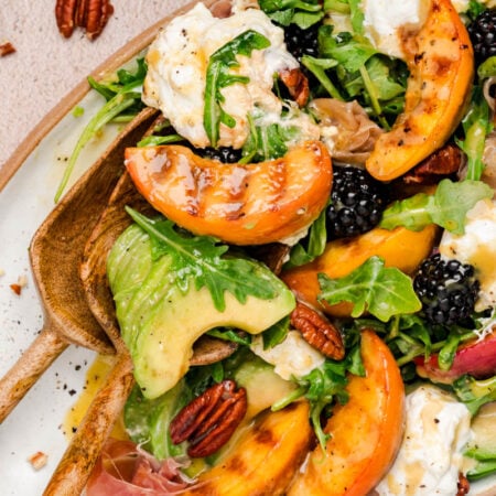 Peach Burrata salad on a table.