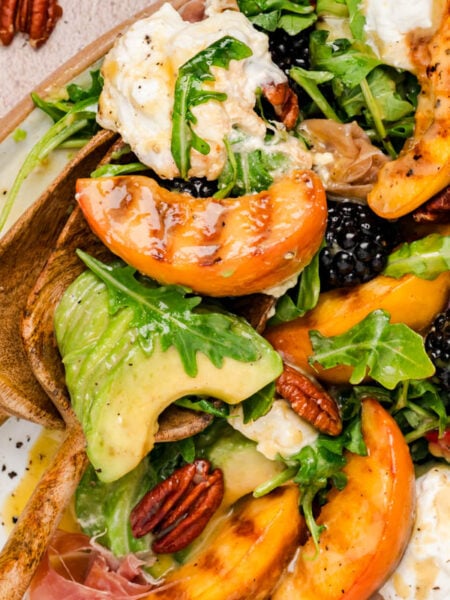 Peach Burrata salad on a table.