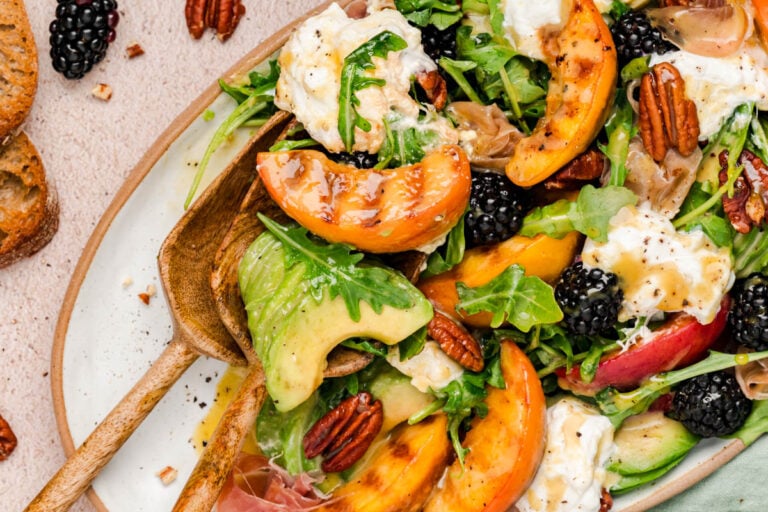 Peach Burrata salad on a table.