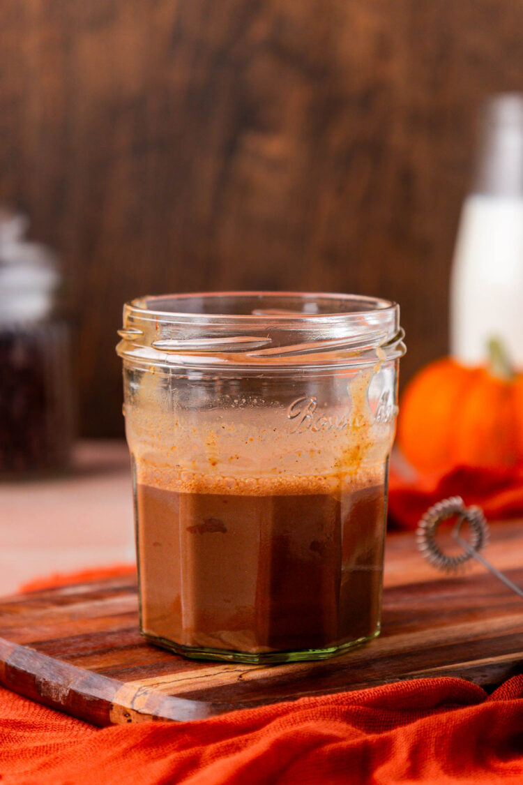 An espresso shot, pumpkin sauce, and nutella frothed in a jar.