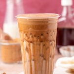 Close up of a large cup filled with an iced latte.