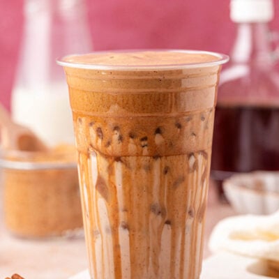 Close up of a large cup filled with an iced latte.
