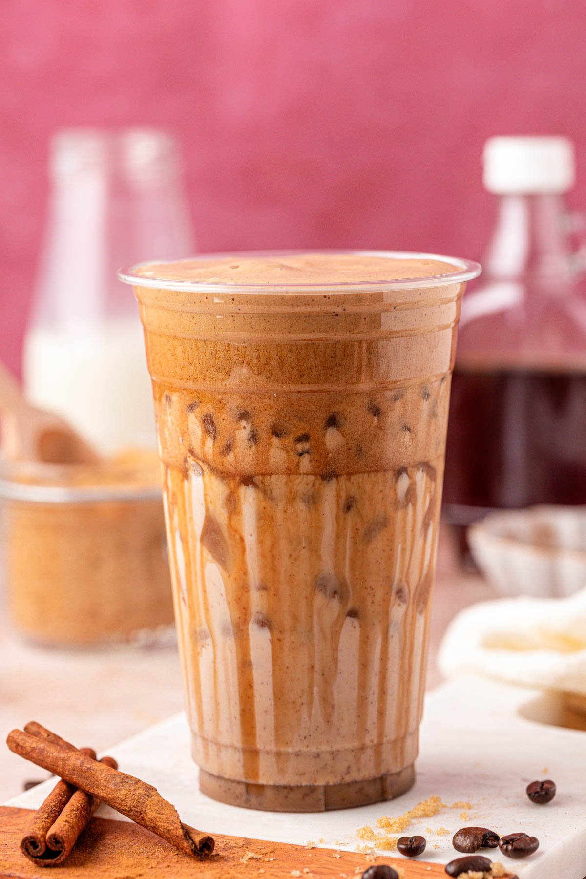 Close up of a large cup filled with an iced latte.