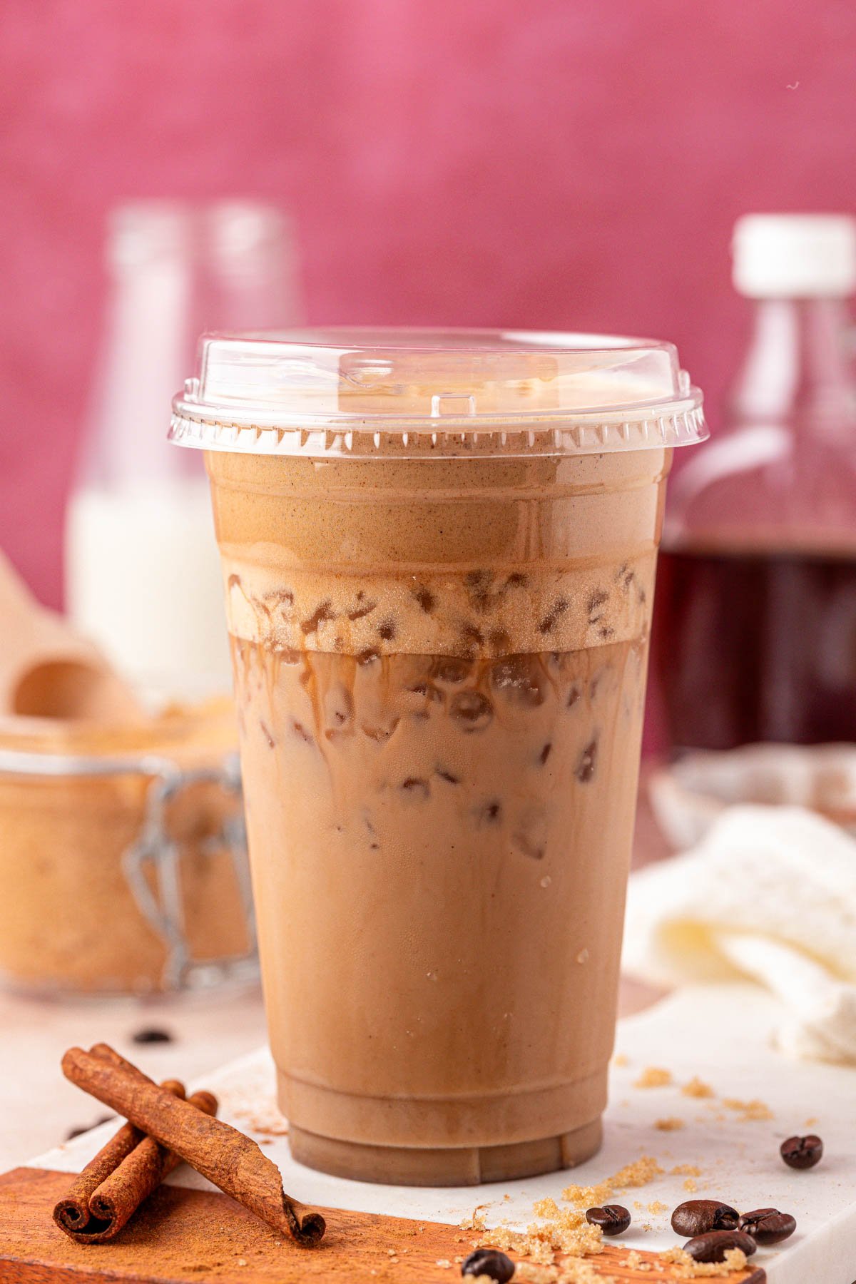 A plastic cup filled with an iced French toast latte.